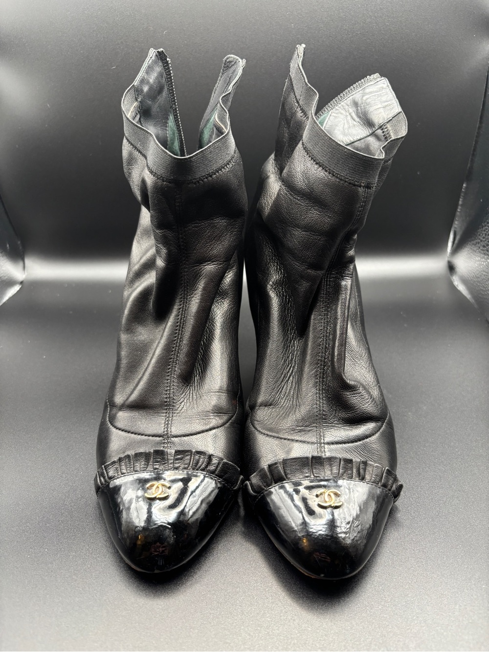 CHANEL Black Leather Cap-Toe Ankle Booties with Gold CC